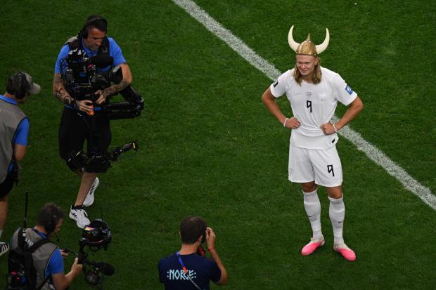 Norway players celebrating together while Brazil players stand disappointed after a World Cup knockout defeat